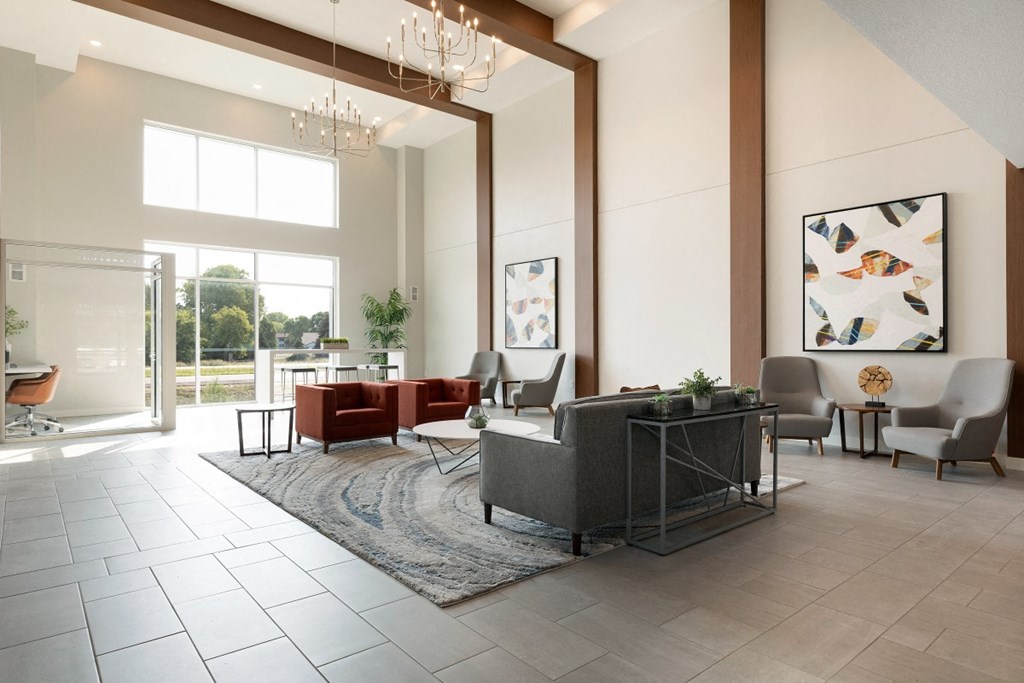 a living room with couches and chairs and a rug