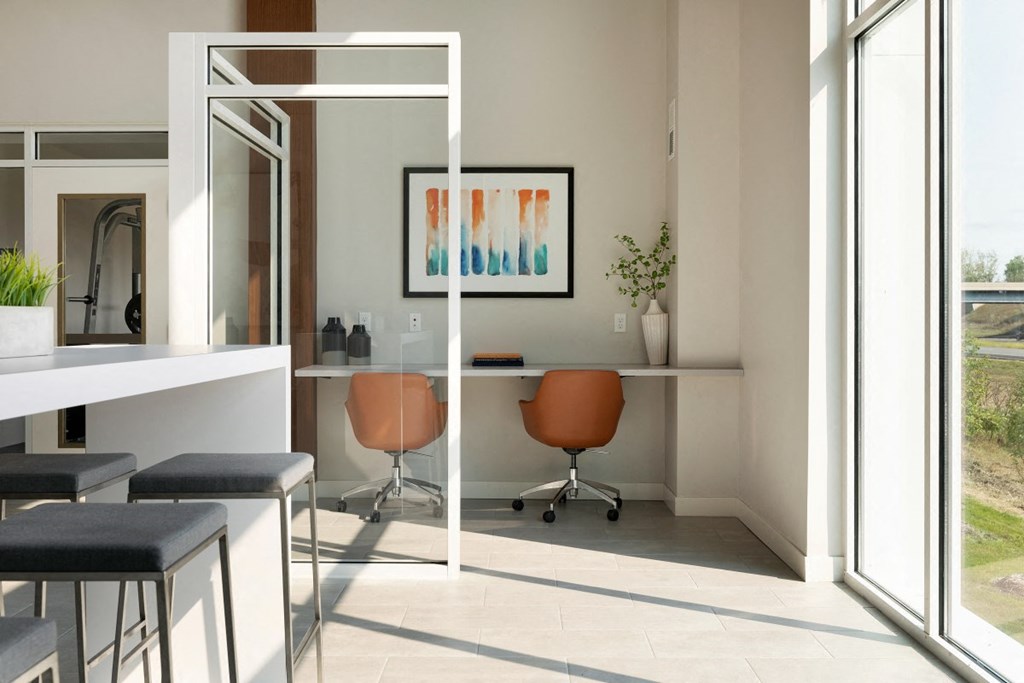 a home office with a desk and chairs in front of a window