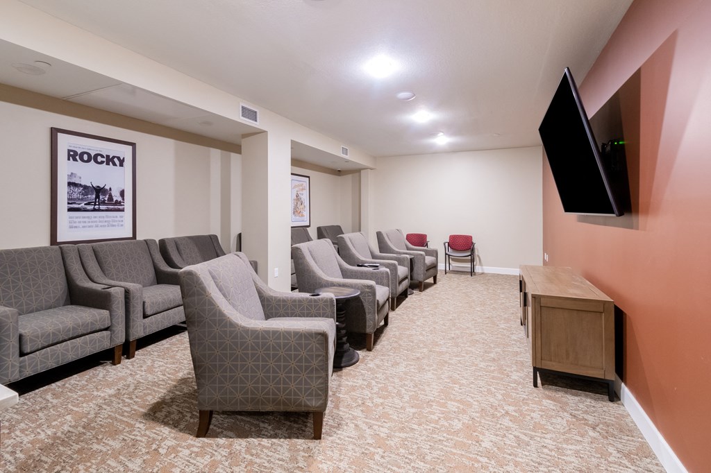 a room filled with furniture and a flat screen tv