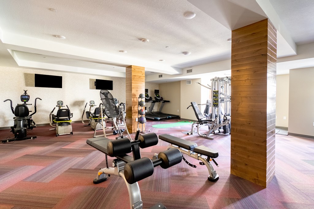 a room filled with lots of different types of exercise equipment