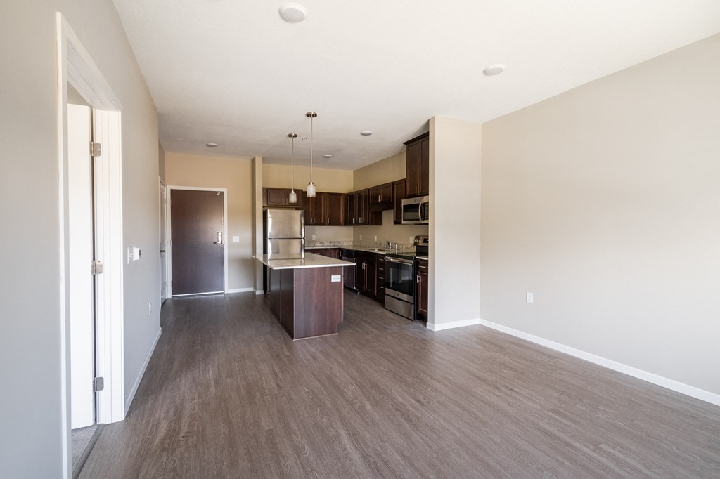 a kitchen and dining area in a 555 waverly unit