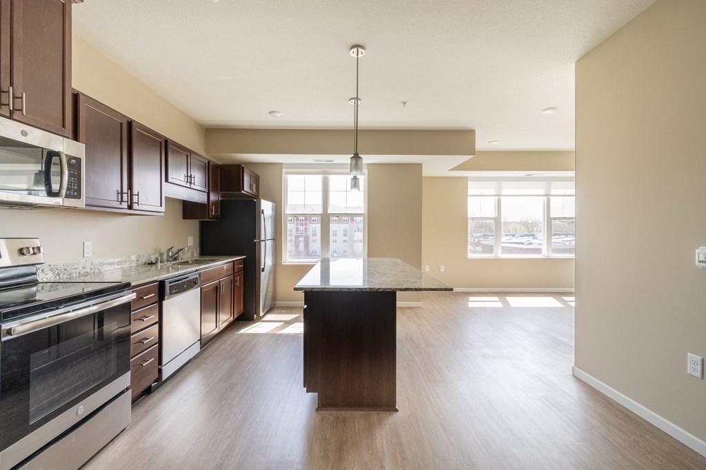 a kitchen and dining area in a 555 waverly unit