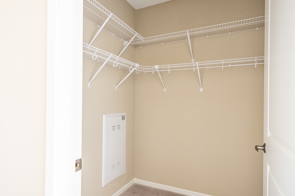 a walk in closet in a 555 waverly unit