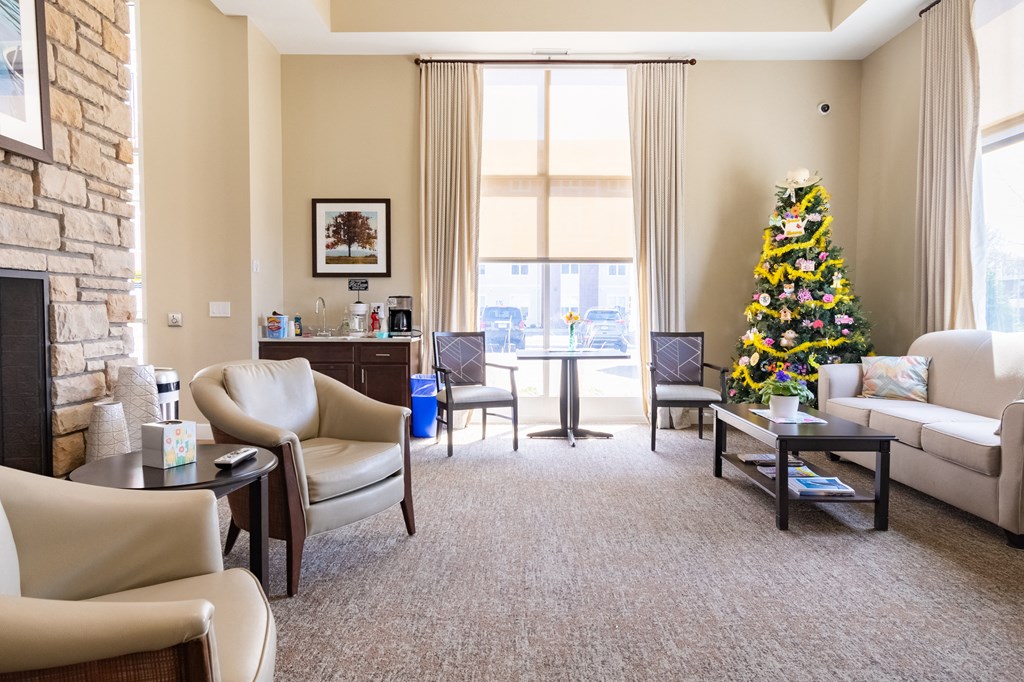 a living room with a christmas tree in the corner