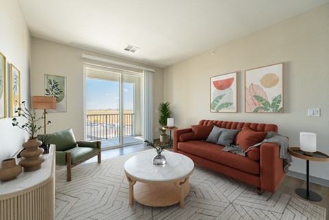 a living room with a red couch and a coffee table