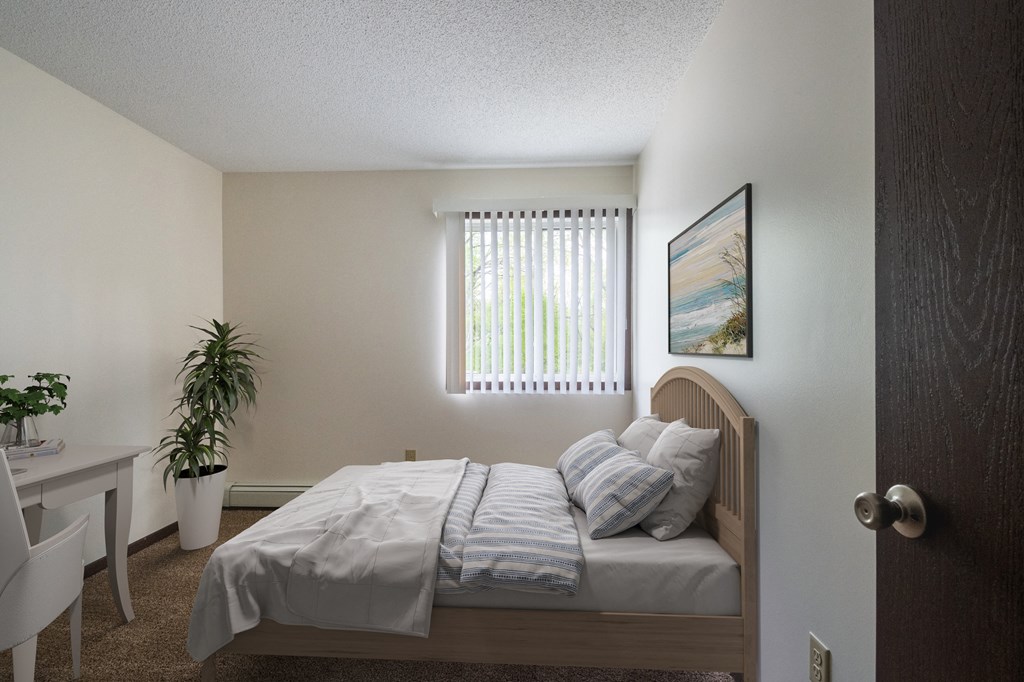 a bedroom with a bed and a desk in a 555 waverly unit