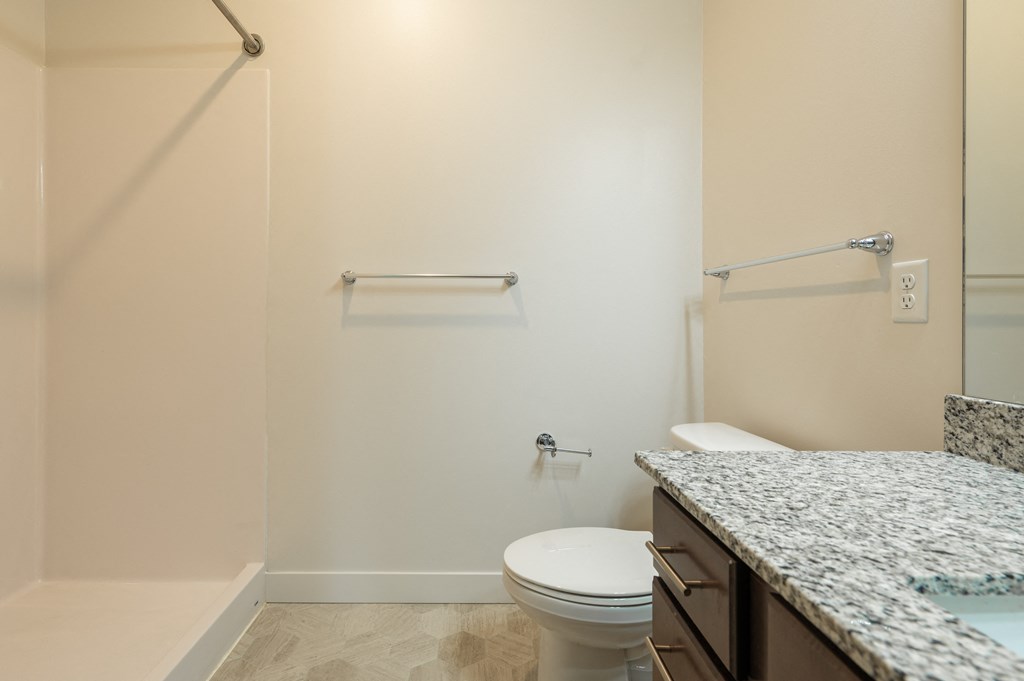 a bathroom with a toilet and a bathtub at Sonder House, Minnesota, 55430