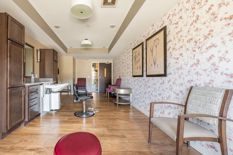 a living room with a couch a chair and a sink at Sonder Point 50+ Apartments, Brooklyn Center, Minnesota