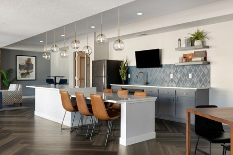 an open kitchen and dining area with a table and chairs