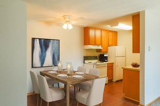 this is a photo of the dining room and kitchen of a 560 square foot 1 bedroom apartment