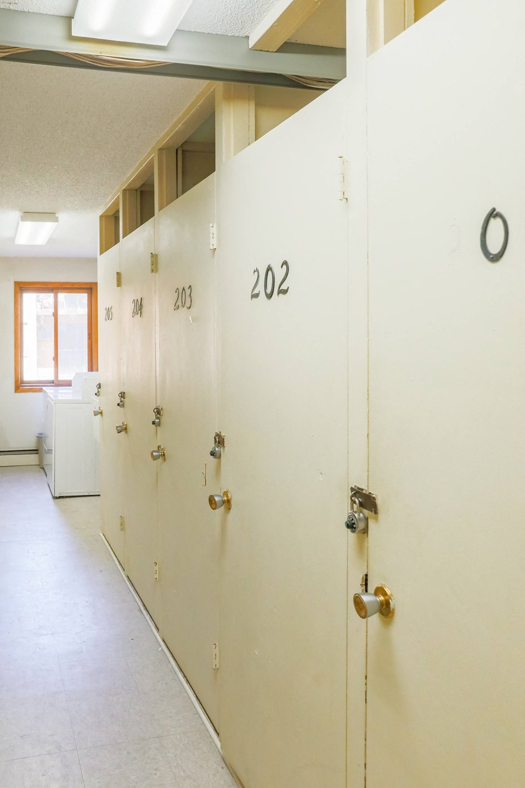 a row of white lockers with numbers on them