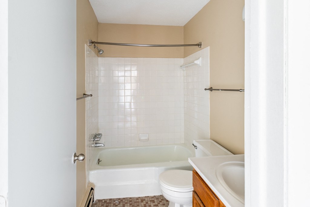 a bathroom with a toilet sink and bathtub