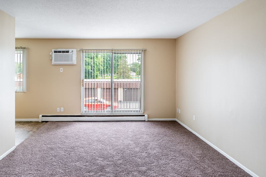the spacious living room at the whispering winds apartments in pearland, tx - Photo Gallery
