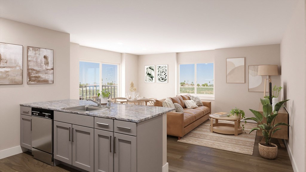 an open living room with a kitchen and a couch