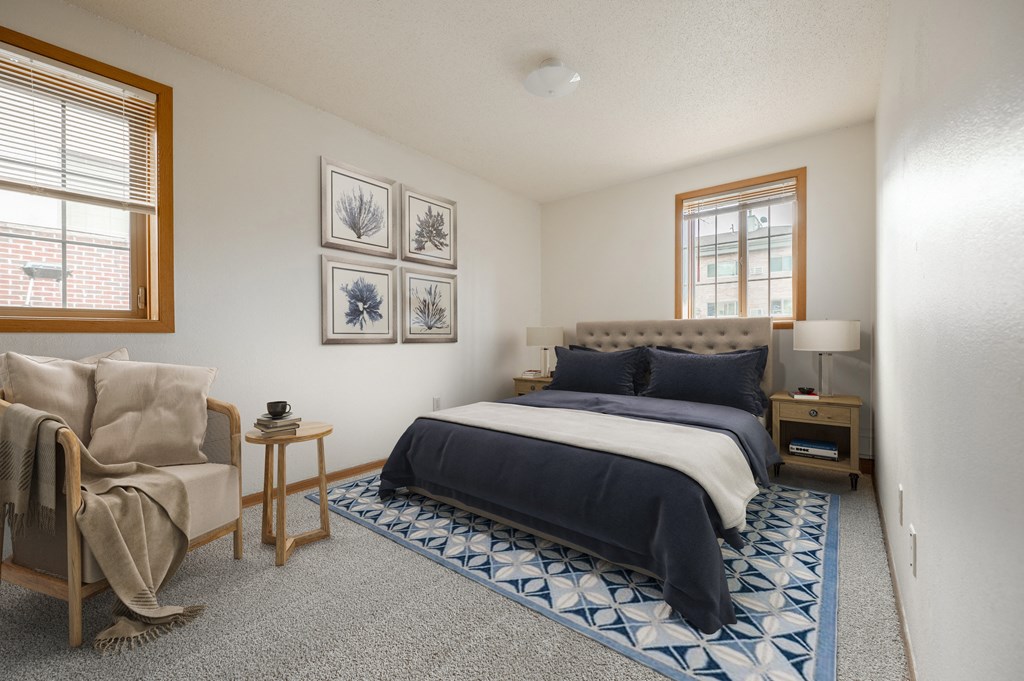 a bedroom with a bed and a chair