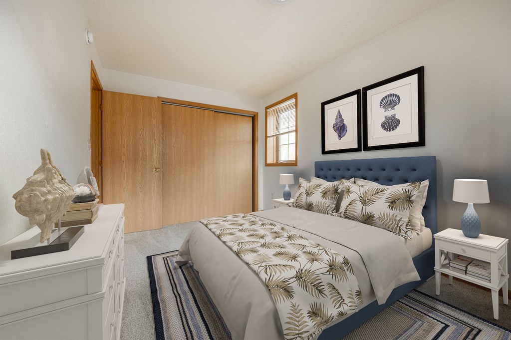 a bedroom with a bed and a dresser