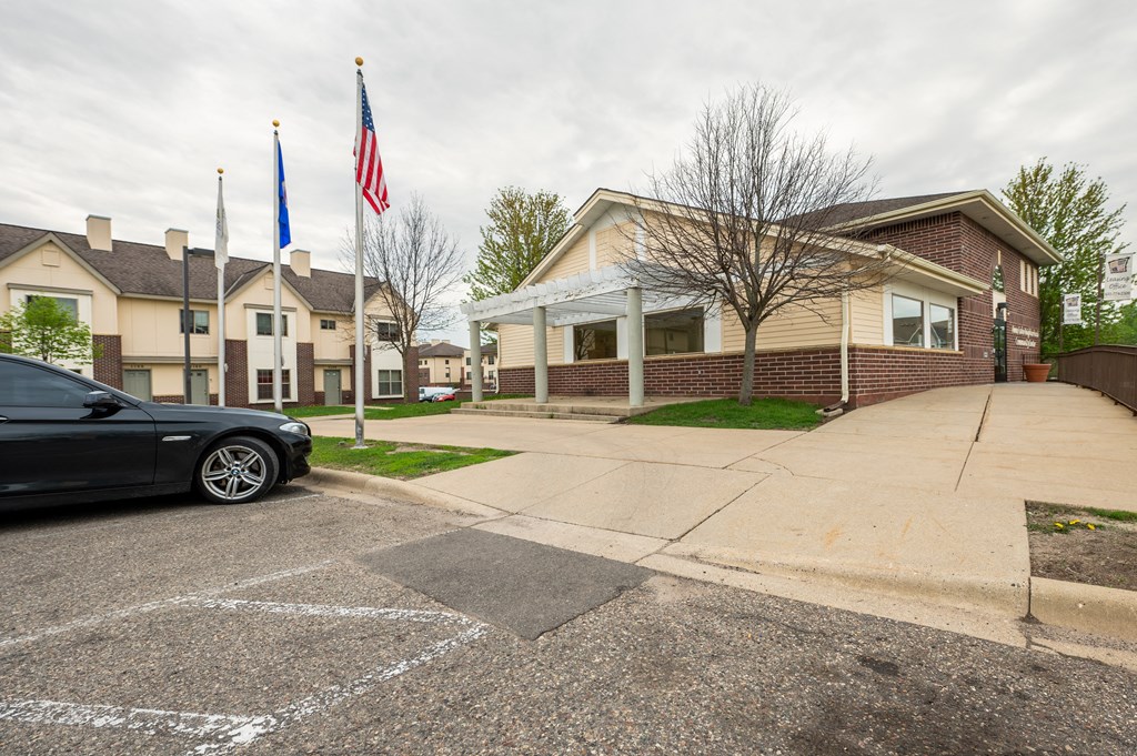 a black car parked in front of a house