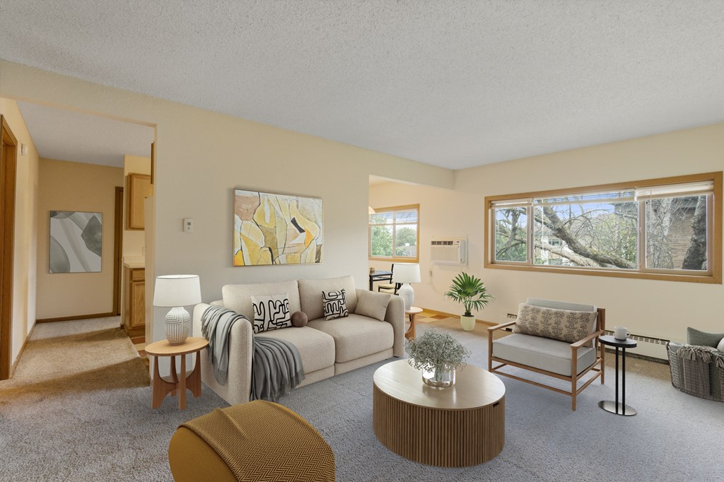 A living room with a couch, chair, and coffee table.