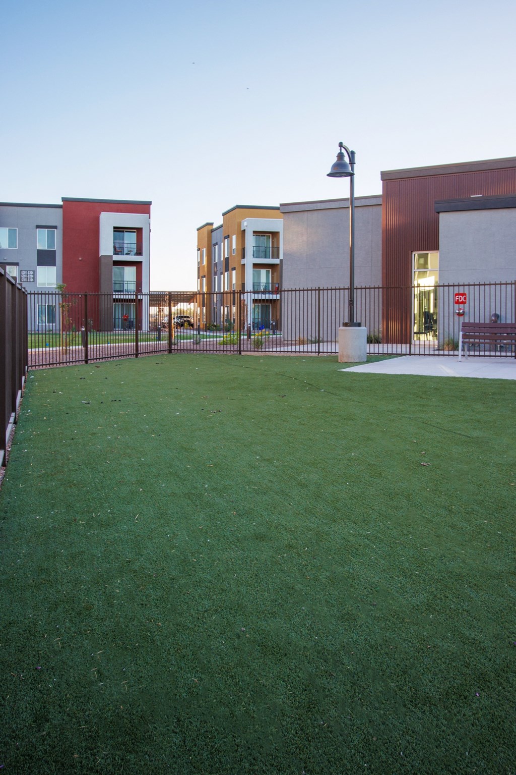 a green lawn in front of a building