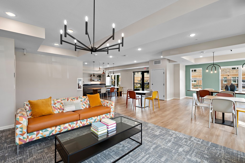 A living room with a sofa, chairs, and a coffee table.