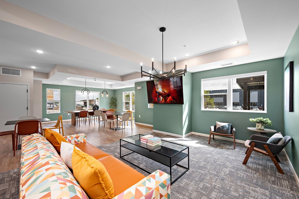A living room with a sofa, chairs, and a coffee table.