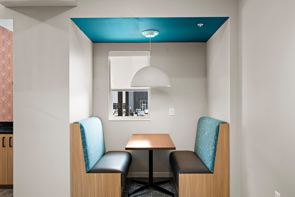 A room with a table and two chairs.