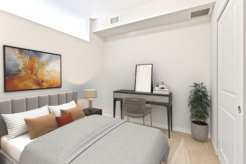 a bedroom with a bed and a desk at EastGate Apartments, Rochester, Minnesota