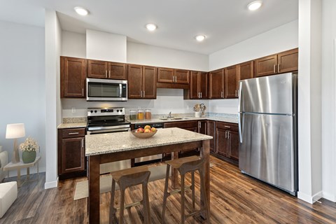a kitchen with stainless steel appliances and a granite counter top