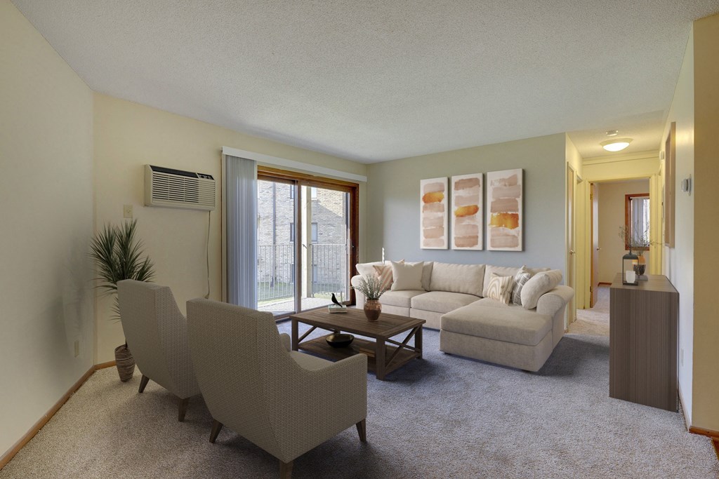 the living room of an apartment with a couch and chairs