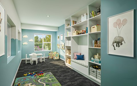 A child's room with a play mat on the floor and a picture of a elephant on the wall.