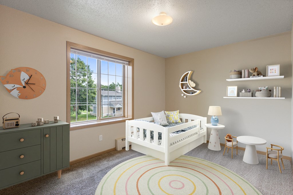a nursery with a crib and a dresser and a window at Ames Lake Neighborhood Apartments, St. Paul, MN