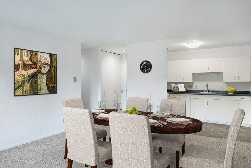 a dining room with a table and chairs and a kitchen at Humboldt Senior 55+ Apartments, Saint Paul, MN, 55107