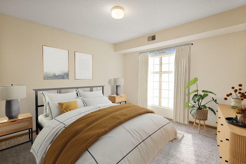 a bedroom with a bed and a window at Ames Lake Neighborhood Apartments, St. Paul, Minnesota