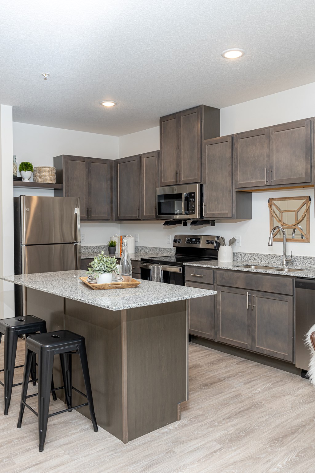 a kitchen with stainless steel appliances and granite counter tops