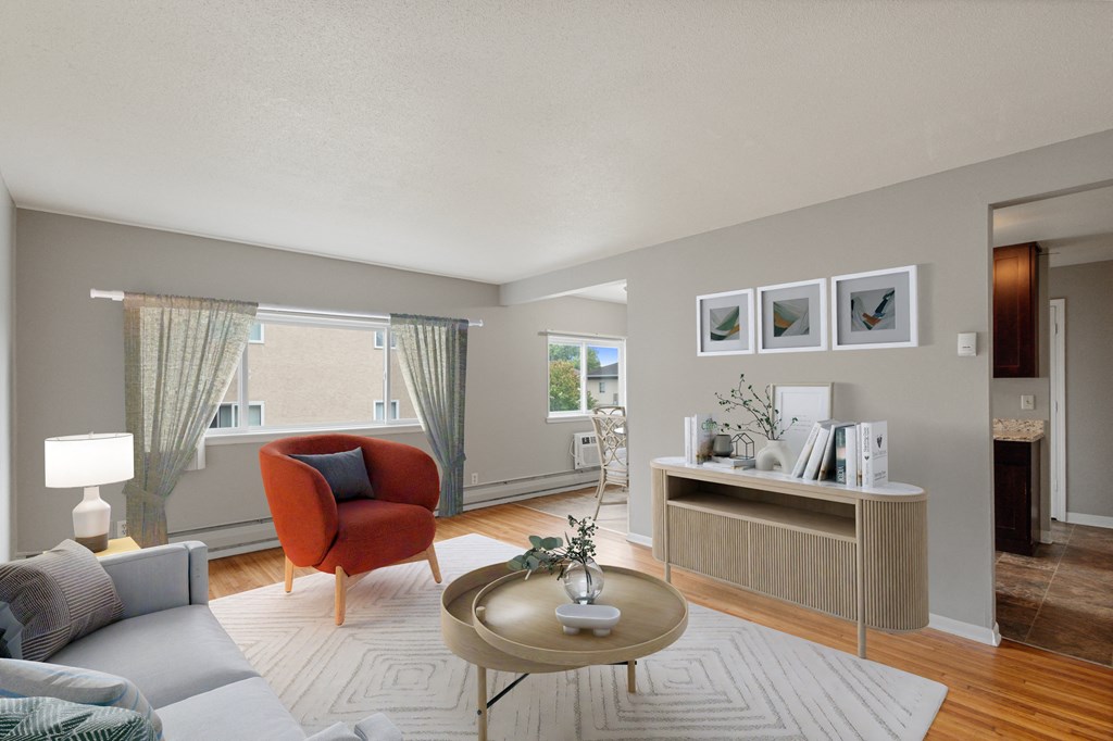 a living room with a couch and a coffee table at Ames Lake Neighborhood Apartments, Minnesota