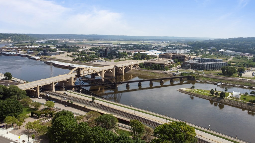 an aerial view of a bridge over a river in a city at Press House Apartments, St Paul, Minnesota