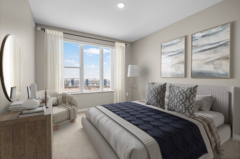A bedroom with a large bed and a view of the city.