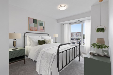 a bedroom with a large bed and a window