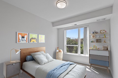 a bedroom with a bed and a large window