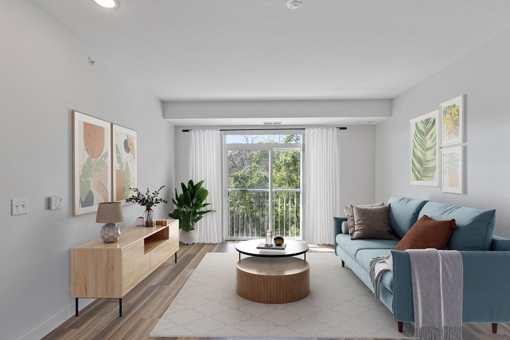 a living room with a blue couch and a coffee table