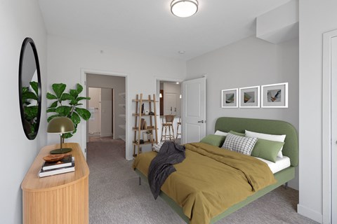 a bedroom with a green bed and a brown blanket