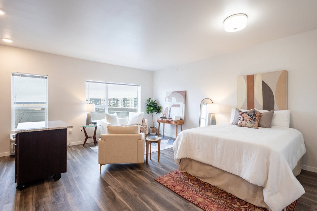 a bedroom with a bed and a desk and a chair at Technology Park Apartments, Rochester, MN, 55901