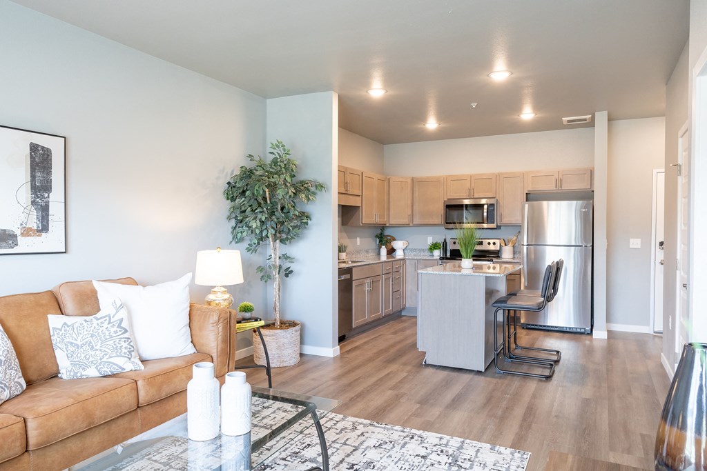 a living room and kitchen with a couch and a table at Technology Park Apartments, Rochester, 55901