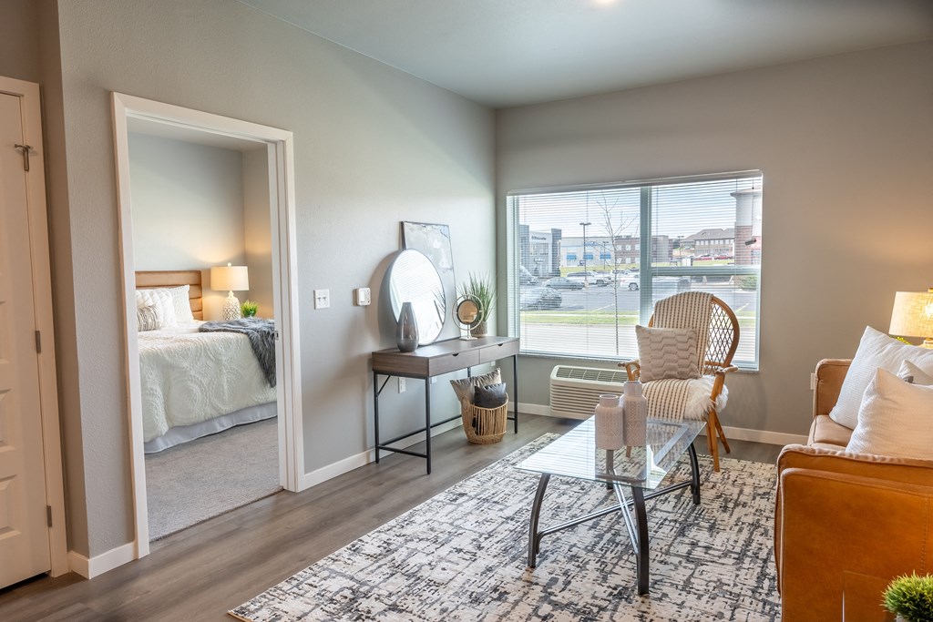 an open living room with a bedroom in the background at Technology Park Apartments, Rochester, 55901