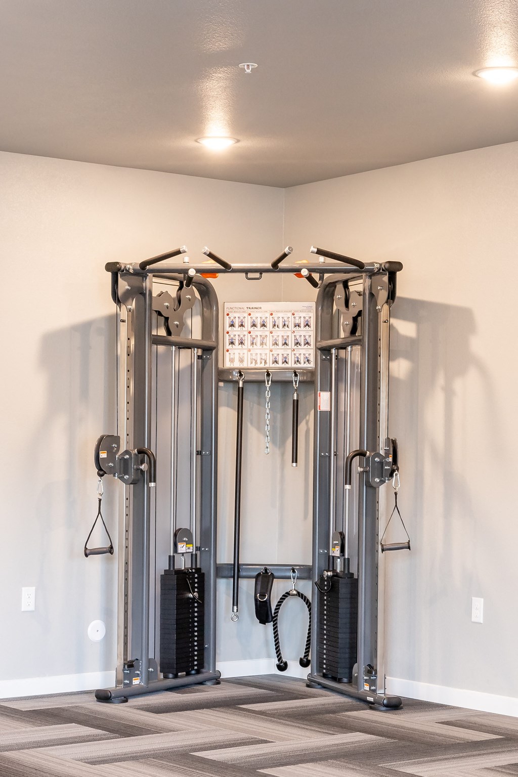 a fitness room with cardio equipment in a home gym at Technology Park Apartments, Rochester, 55901