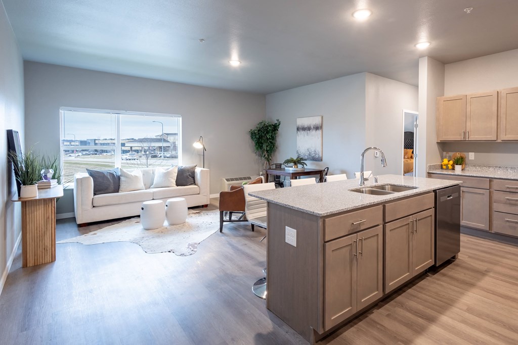 an open living room and kitchen with a view of the city at Technology Park Apartments, Rochester, MN, 55901