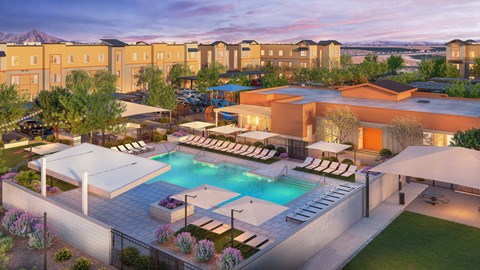 A large outdoor swimming pool surrounded by lounge chairs and umbrellas.
