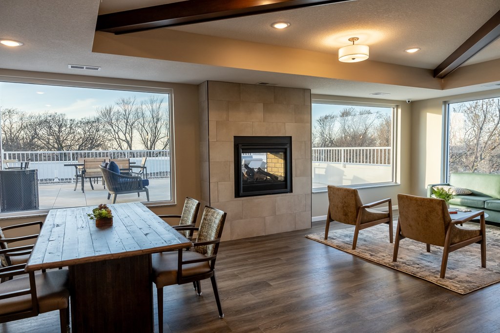 the retreat dining room with table and chairs and a fireplace