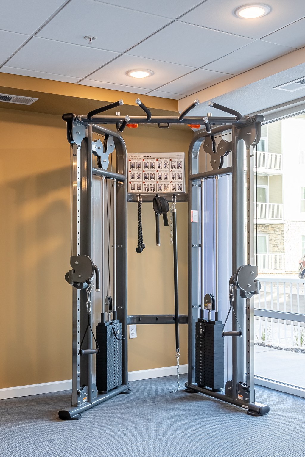 a fitness room with weights and a treadmill