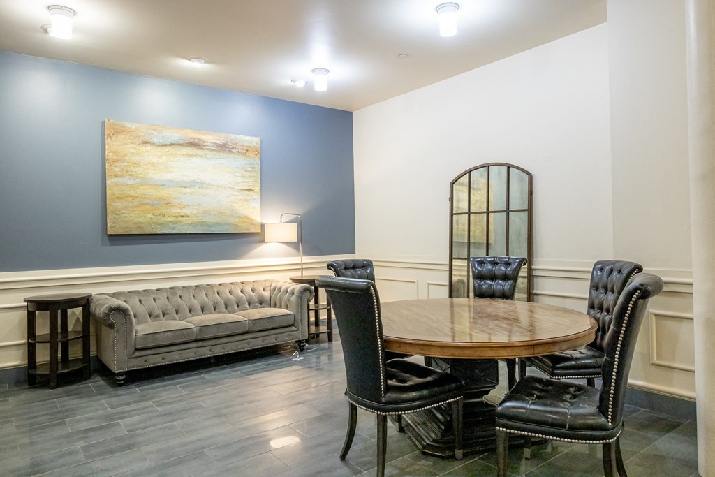 a dining room with a table and chairs and a couch